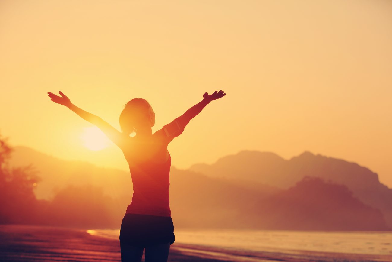 Woman with arms outstretched, celebrating the antioxidant carotenoid content of Panaferd®
