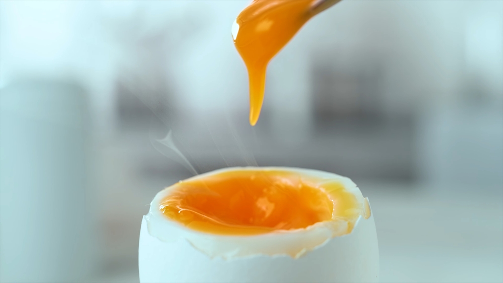 Boiled egg with runny yolk and healthy orange color